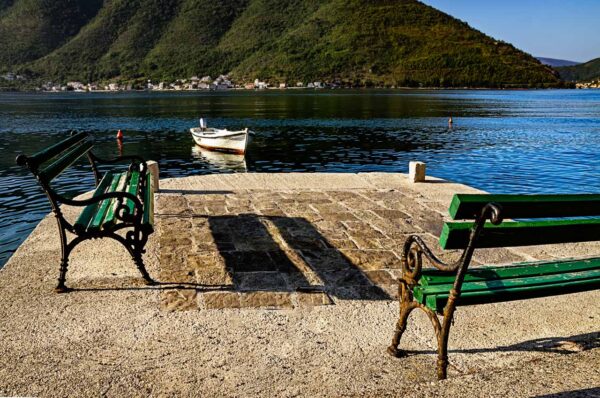 Benches close to the water edge in Perast